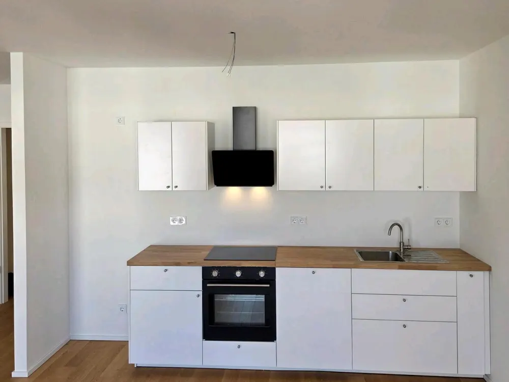 2-Zimmer Neubauwohnung mit EBK & Balkon in top Lage in D-Heerdt