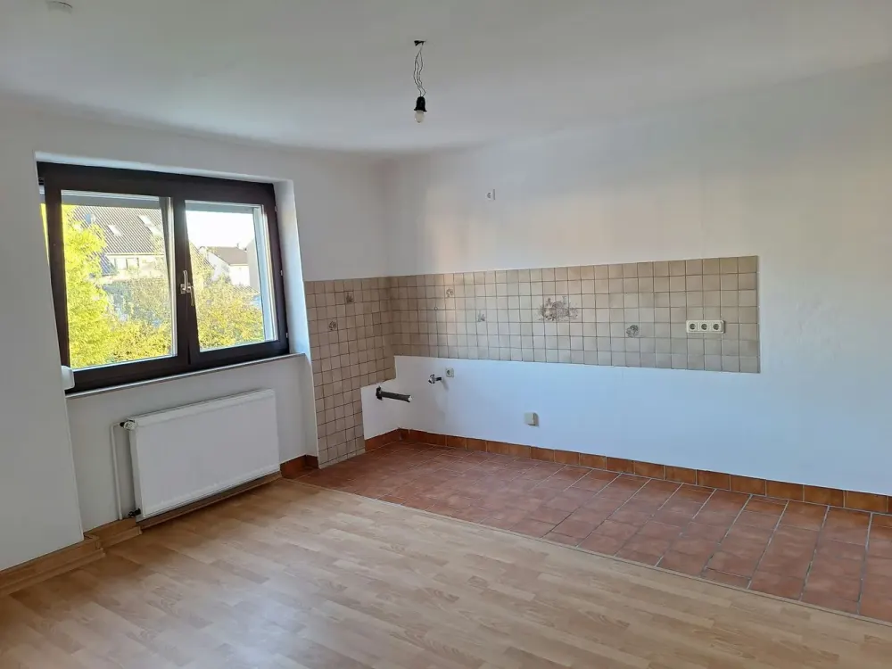 2028; 2-Room Apartment with Balcony, Shared Garden Use & Garage in Völklingen