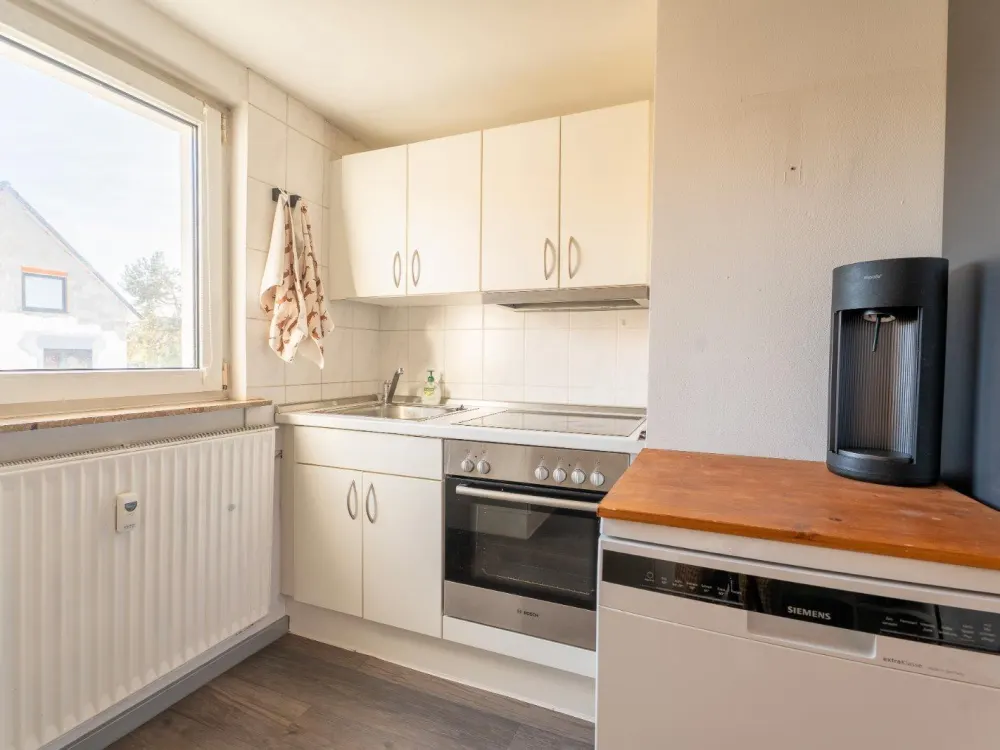 Große Dachgeschosswohnung mit privaten Gartenanteil