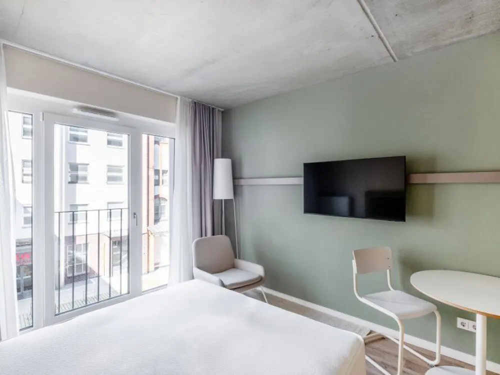 Modernes Studioapartment mit Gym, Coworking & Rooftop am Schloss Charlottenburg