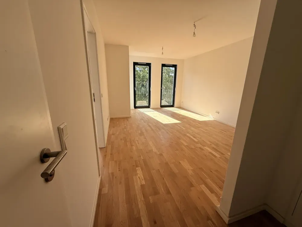 Erstbezug/Neubau: Helle 2-Zimmer-Neubauwohnung mit Südwest-Balkon und Eichenparkett