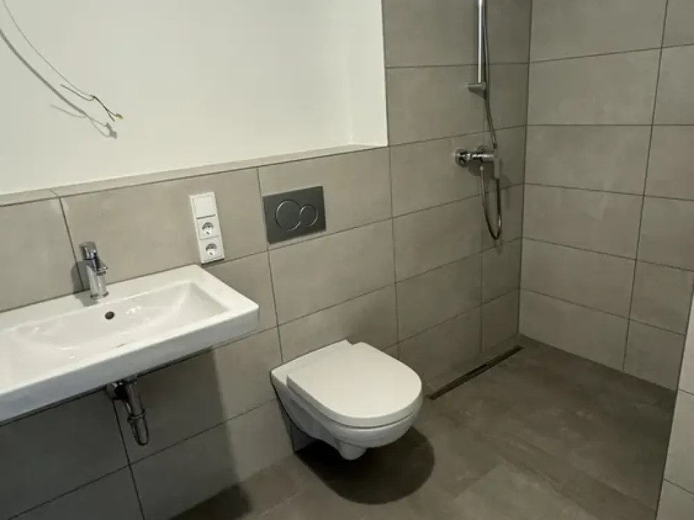 Erstbezug: Helle 1-Zimmer-Wohnung mit Terrassenabteil im Erdgeschoss