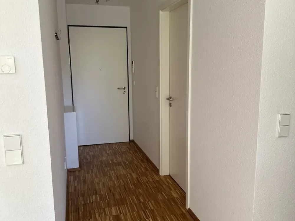 Hochwertige 2-Zimmer-Wohnung mit Terrasse, Einbauküche & Tiefgarage in ruhiger Lage