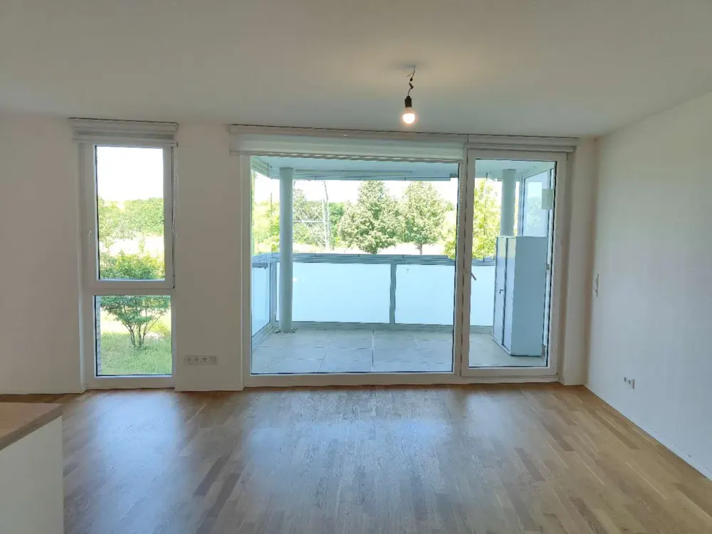 Vier Zimmer in Riedberg: Moderne Wohnung mit Balkon und weitem Blick ins Grüne