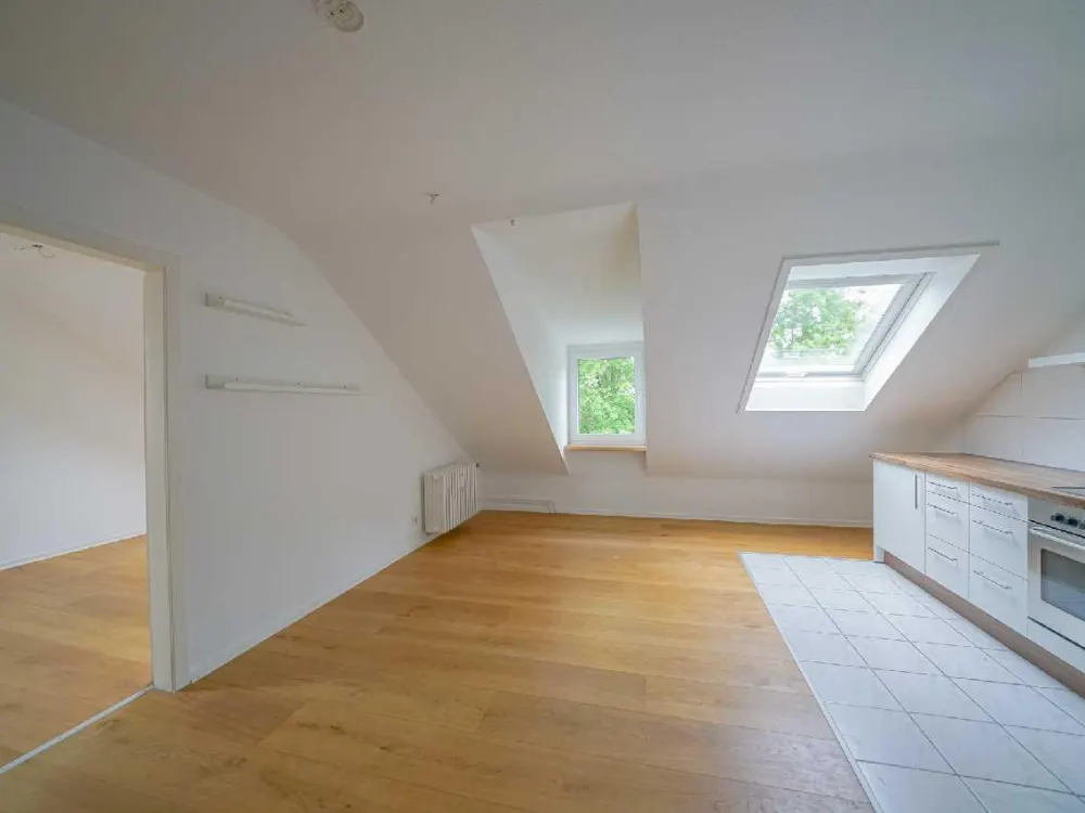 Ratingen-Süd: Gemütliche 3-Zimmer-Dachgeschosswohnung mit EBK und Gartenmitbenutzung im Grünen