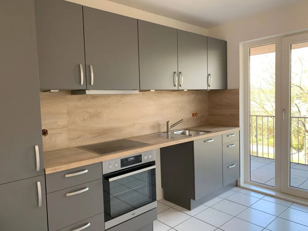 Lichtdurchflutete Maisonettewohnung mit Balkon und Dachterrasse