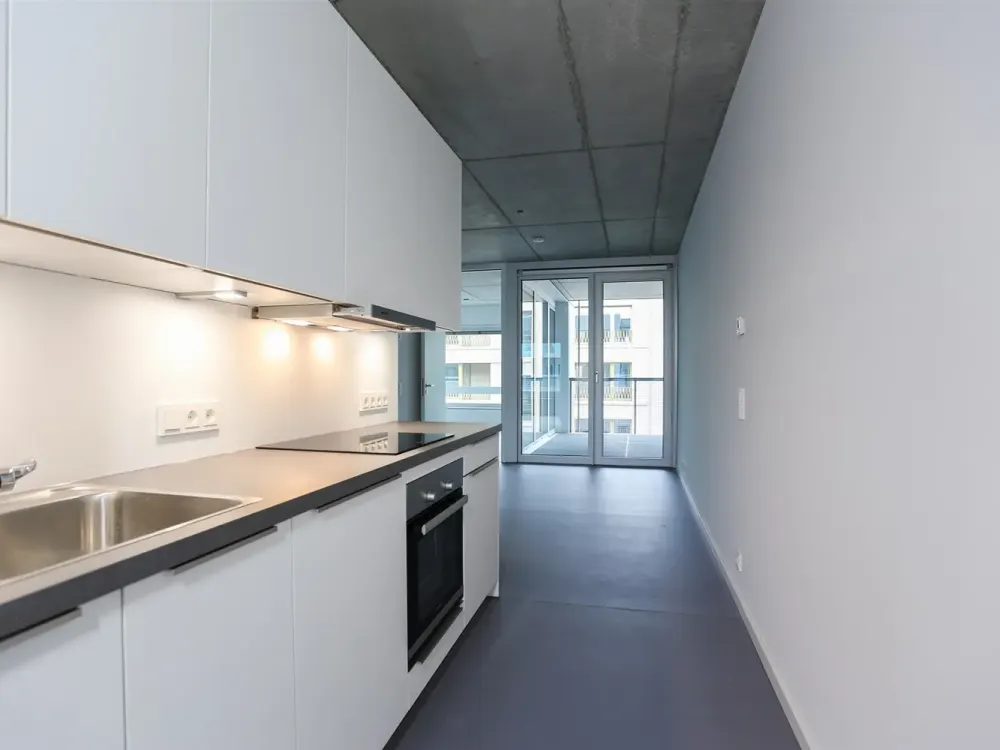Dreamily bright city apartment with stylish exposed concrete ceilings on the 6th floor of a modern new building