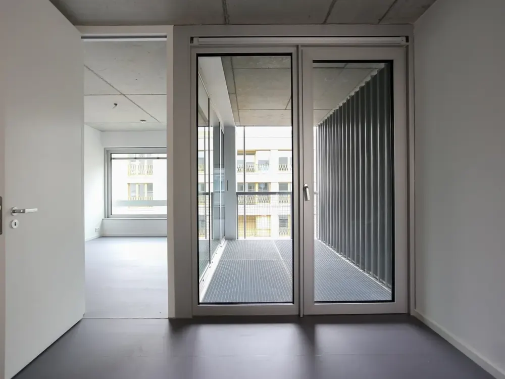 Dreamily bright city apartment with stylish exposed concrete ceilings on the 6th floor of a modern new building