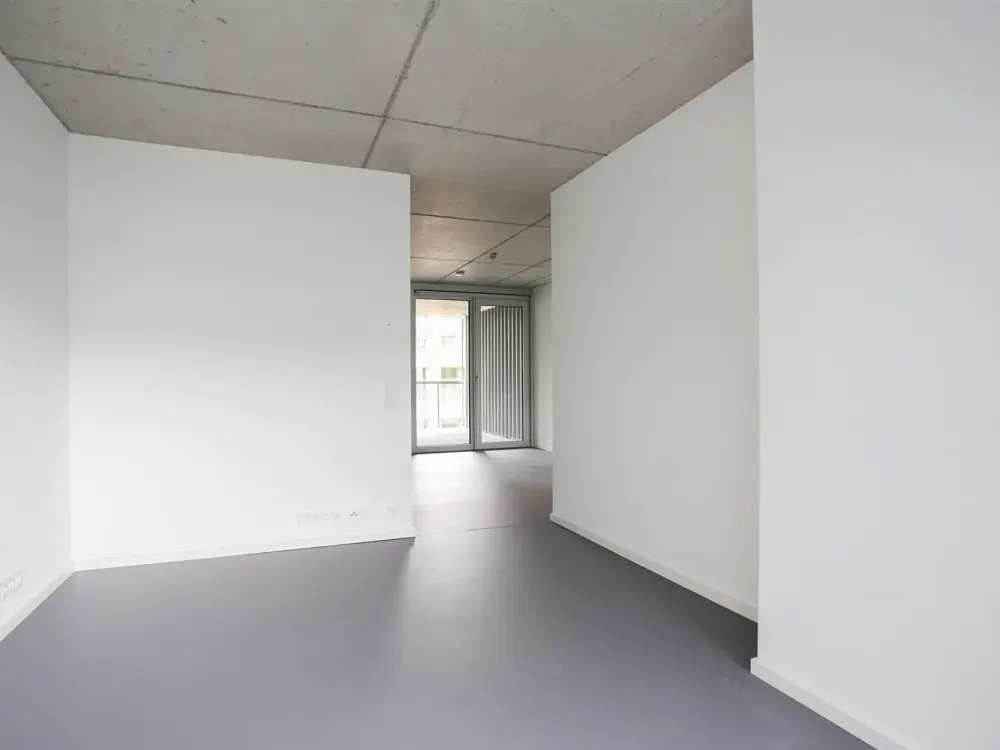 Dreamily bright city apartment with stylish exposed concrete ceilings on the 6th floor of a modern new building