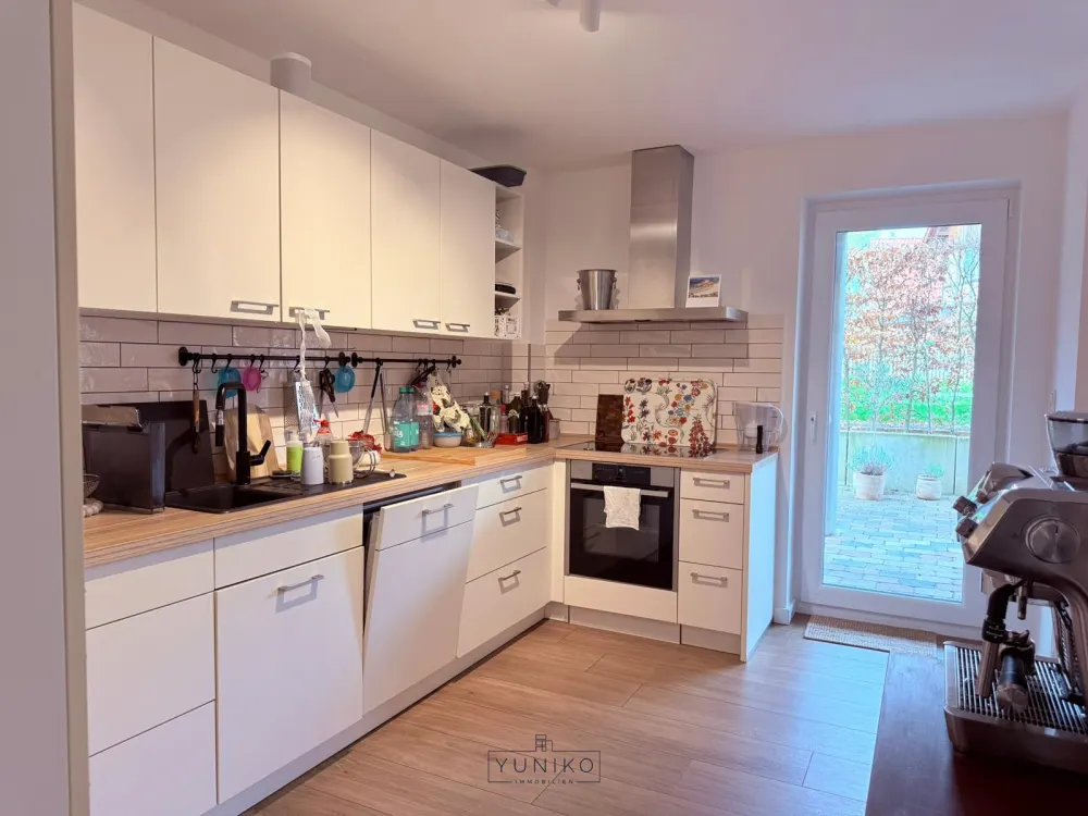 Moderne Erdgeschosswohnung mit großzügigem Wohn-/Essbereich, Terrasse und hochwertiger Einbauküche