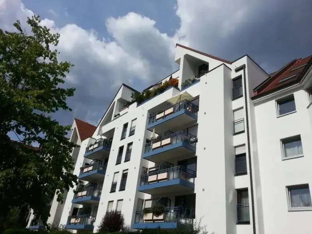 The apartment is located on the 4th floor of a multi-family house with an elevator