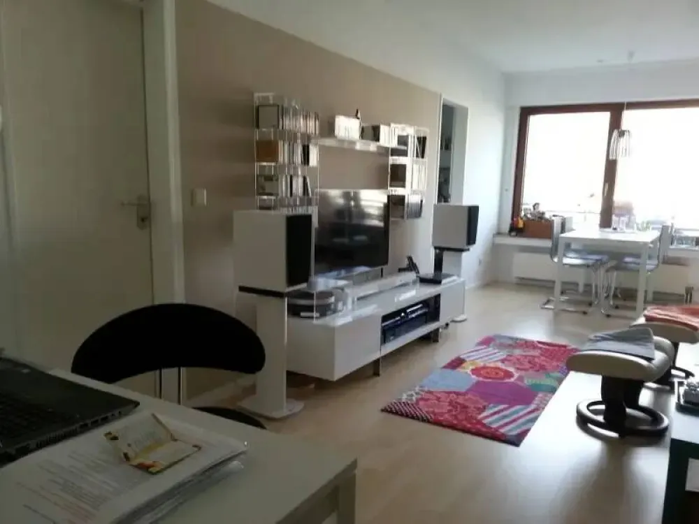 The apartment is located on the 4th floor of a multi-family house with an elevator