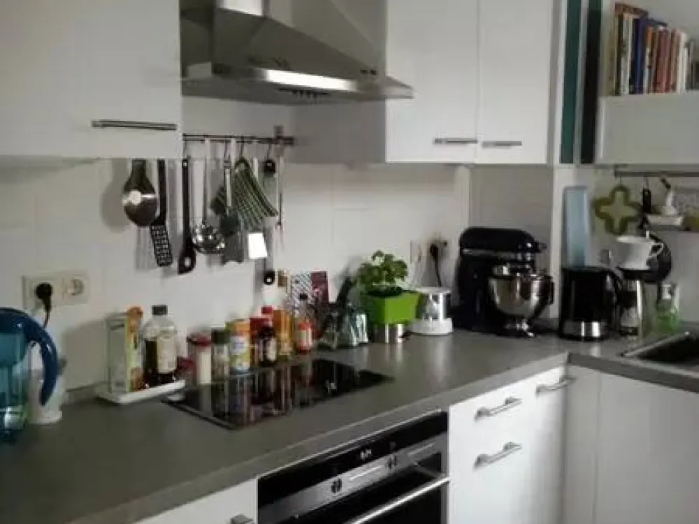 The apartment is located on the 4th floor of a multi-family house with an elevator