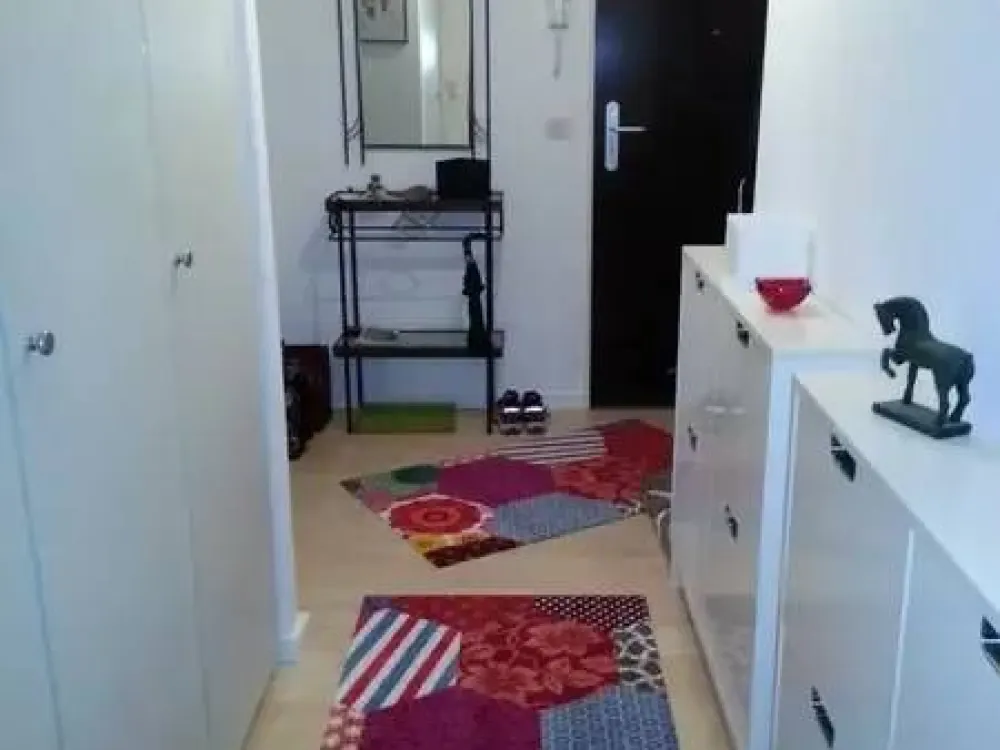 The apartment is located on the 4th floor of a multi-family house with an elevator