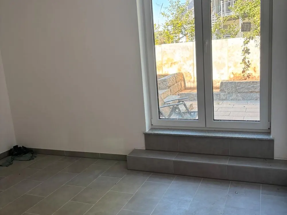 3,5 Zimmerwohnung mit schöner Terasse und Gartenanteil