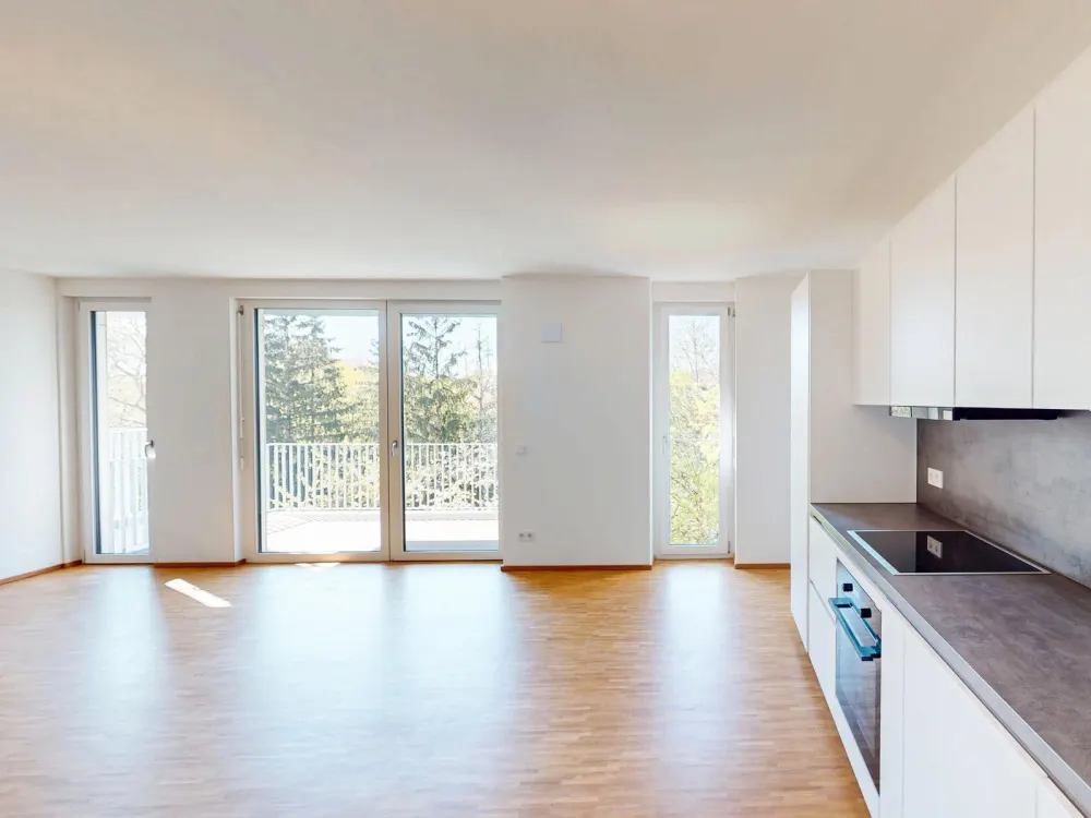 Ein Neubau für das Leben im Quartier mit großzügigem Wohnbereich und Balkon