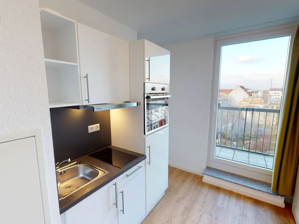 ** Möbliertes 2-Zimmer-Apartment mit EINBAUKÜCHE, französichen BALKON und gemeinschaftlicher DACHTERRASSE **