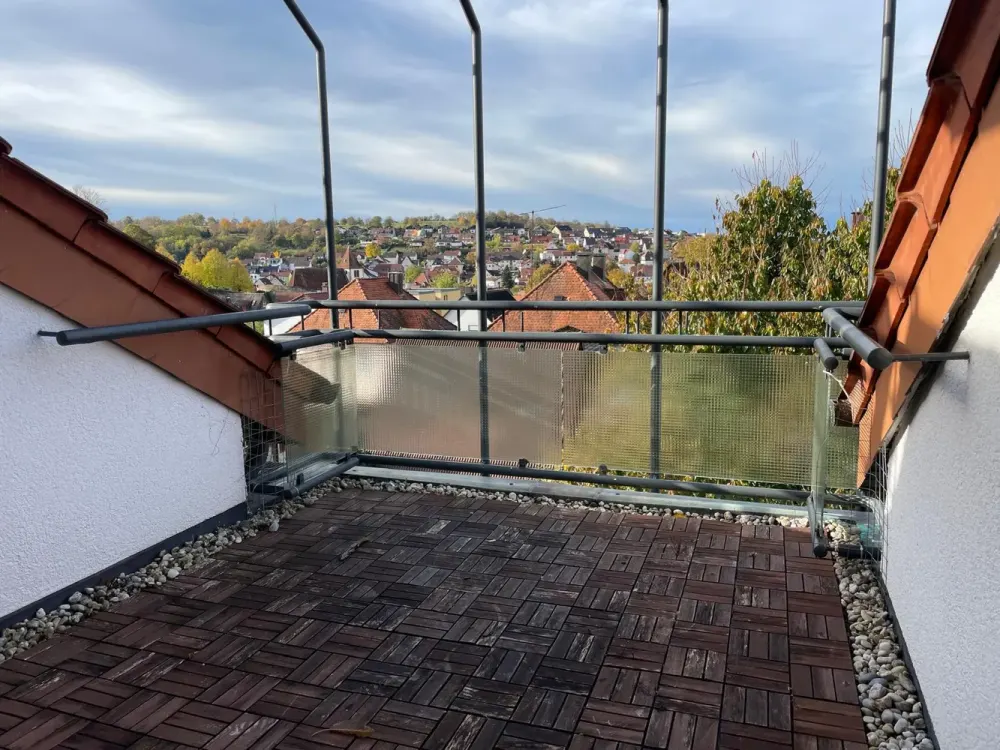 Above the Roofs of Dietlingen: Cozy 2-Room Maisonette with Panoramic Balcony & Parking Space