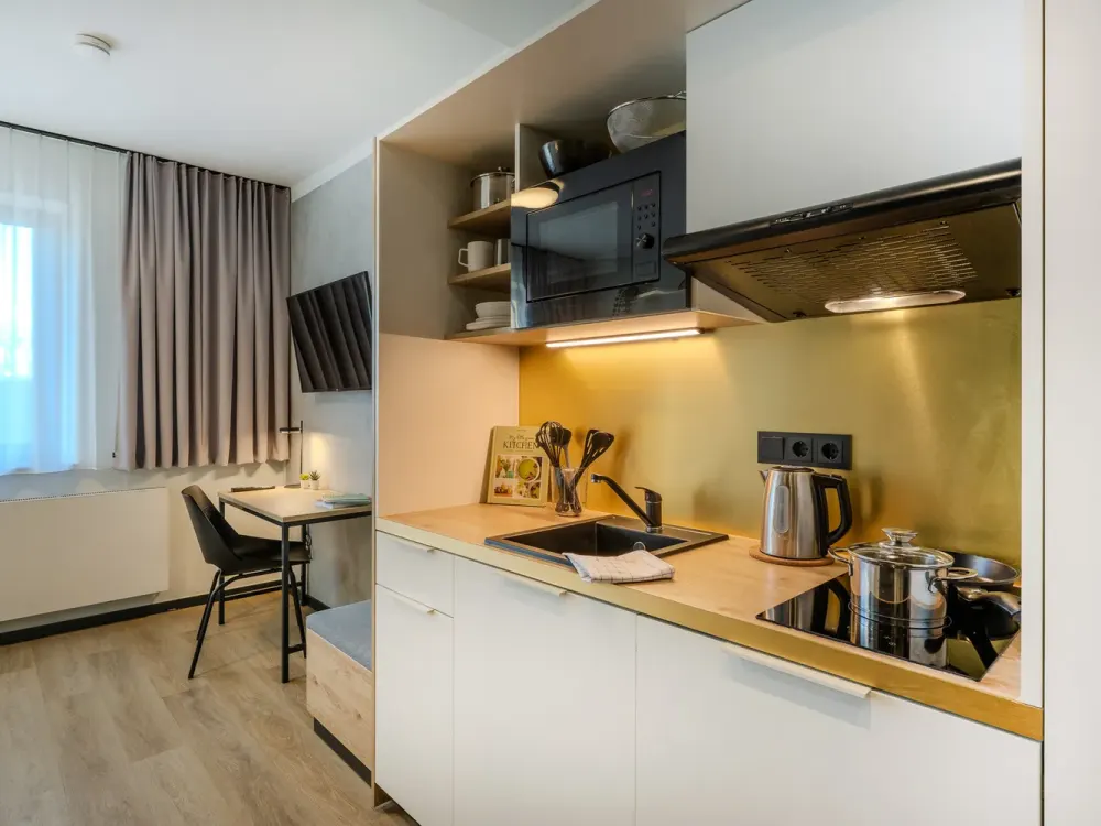 Furnished micro apartments with community spaces, coworking and gym