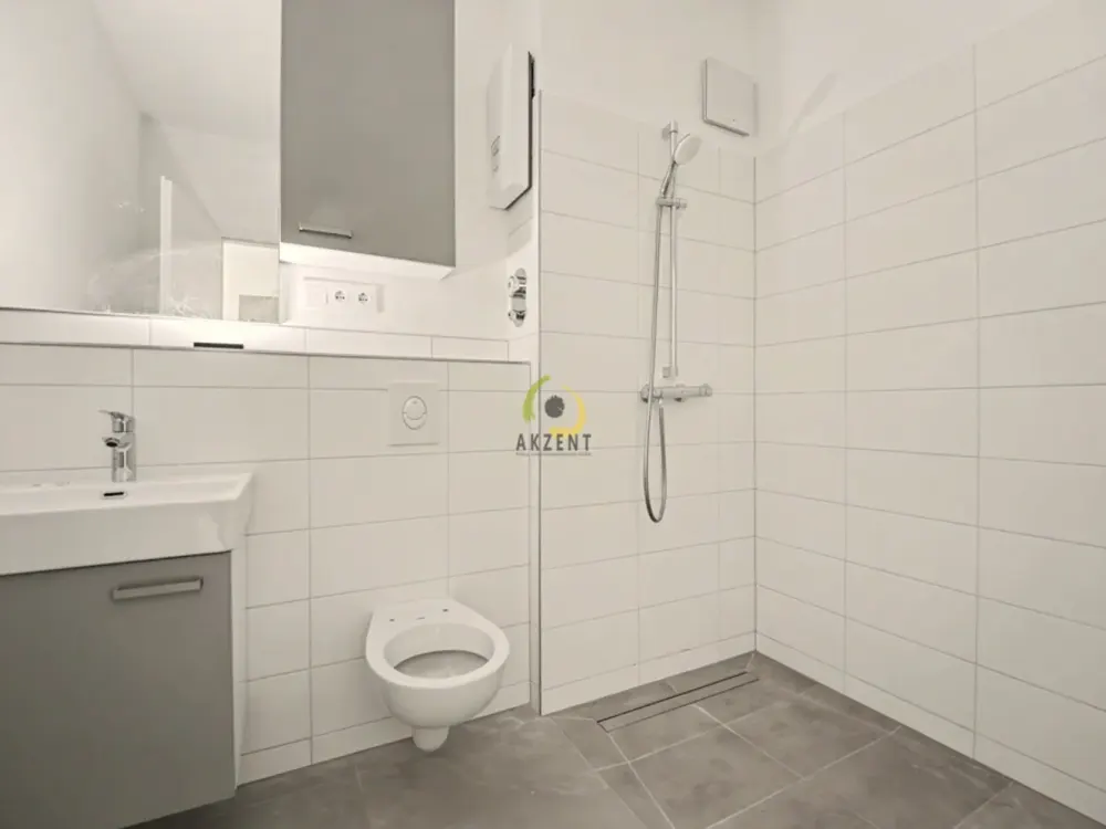 Erstbezug - Stilvolle 1,5-Zimmer-Neubauwohnung mit Balkon, EBK & Möblierung - Direkt am S-Bahnhof