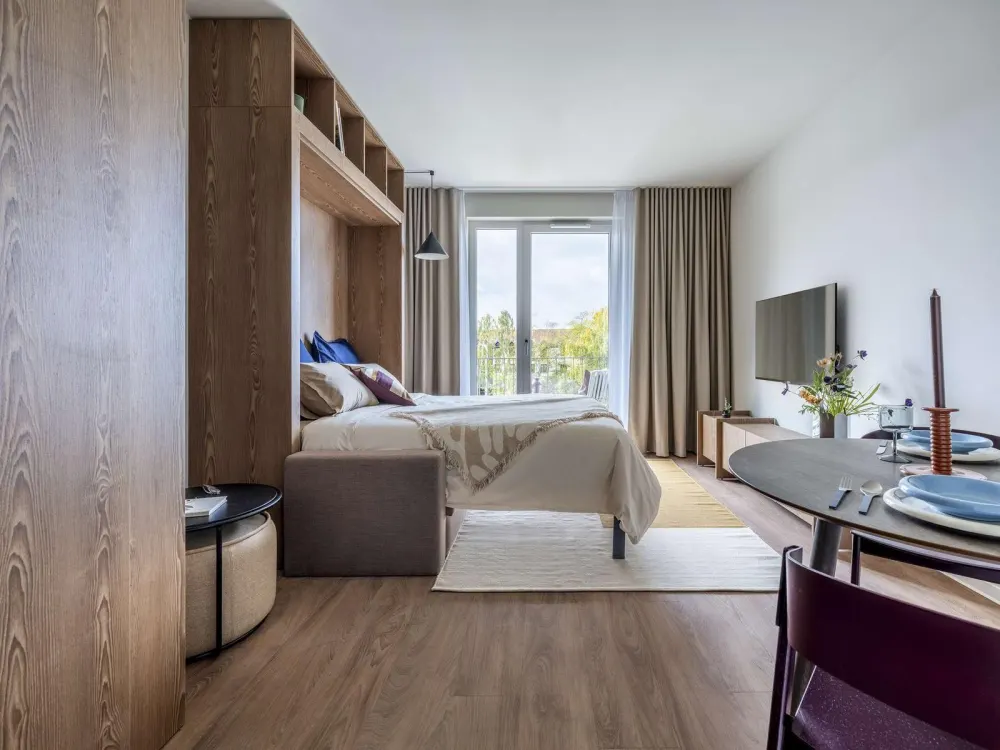 Möblierte Studio Wohnungen mit Gemeinschaftsflächen: Padelplatz, Fitness, Dachterrasse & mehr