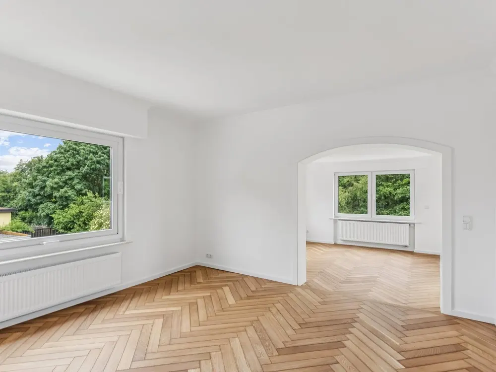 Exklusive 3,5-Zimmer-Wohnung mit Wintergarten, Designerbad und idyllischem Gartenparadies