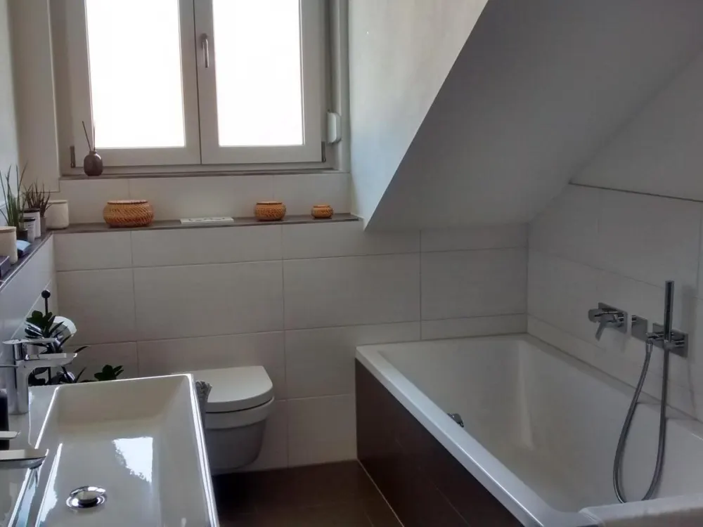 Modern 3-Room Attic Apartment with Swedish Stove, Balcony & High-Quality Features