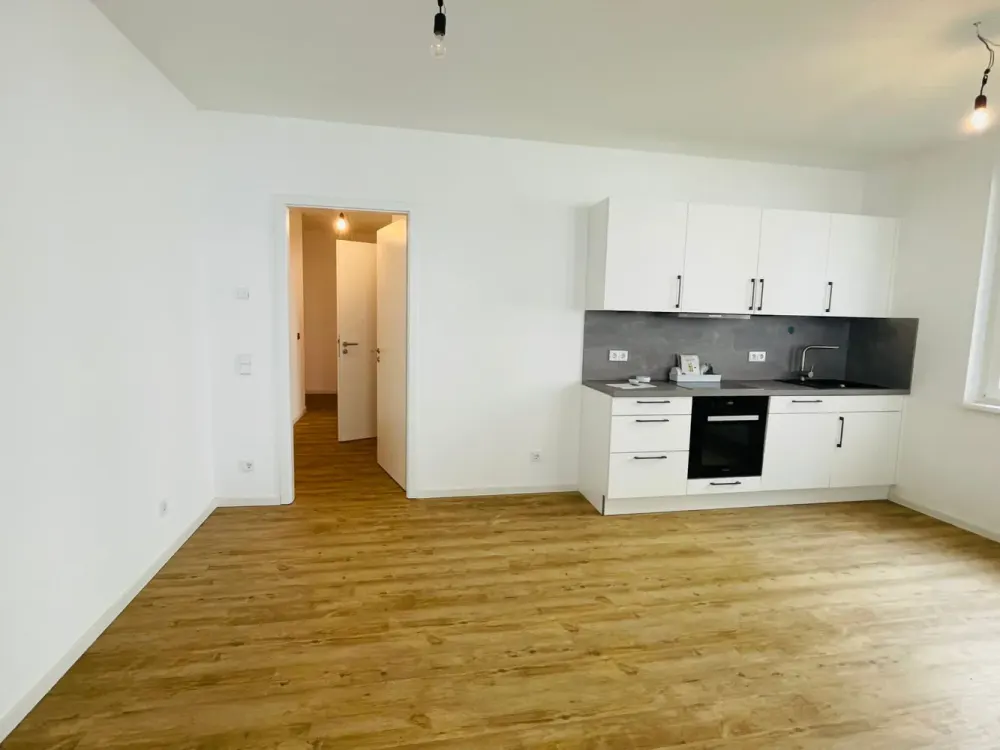 Schicke Neubauwohnung mit eigener Terrasse und EBK sucht neue Bewohner!
