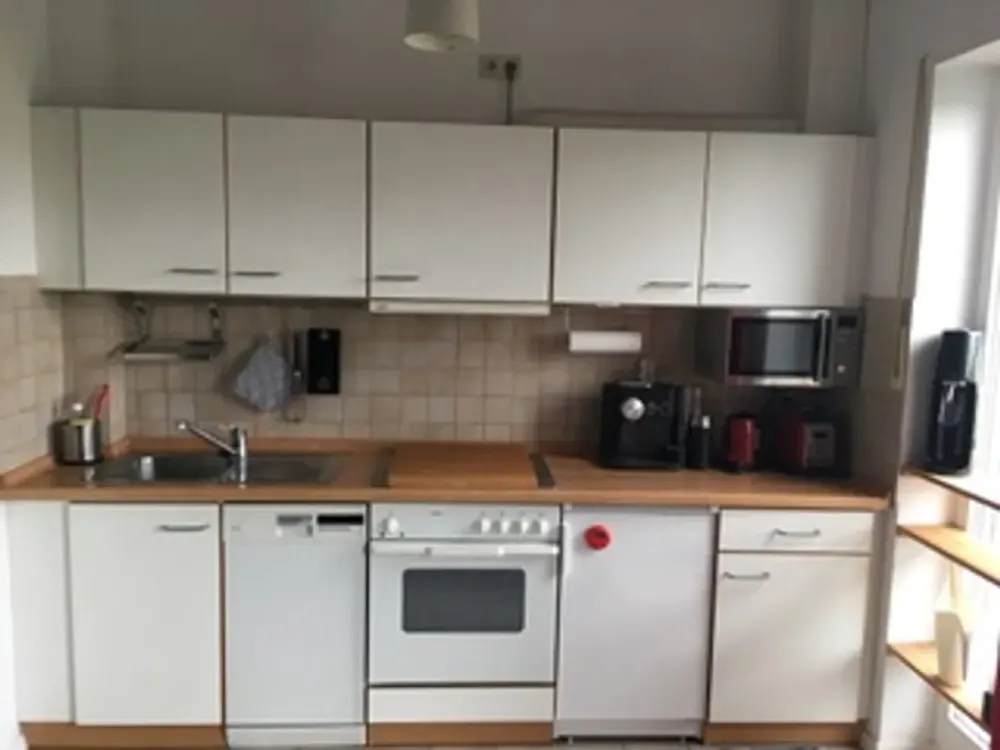 Stilvolle, gepflegte 1,5-Zimmer-Dachgeschosswohnung mit Balkon und EBK in Taufkirchen