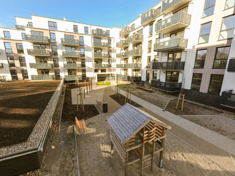 Barrier-free new-build apartment with fitted kitchen, south-facing balcony, real wood parquet, elevator, underground parking