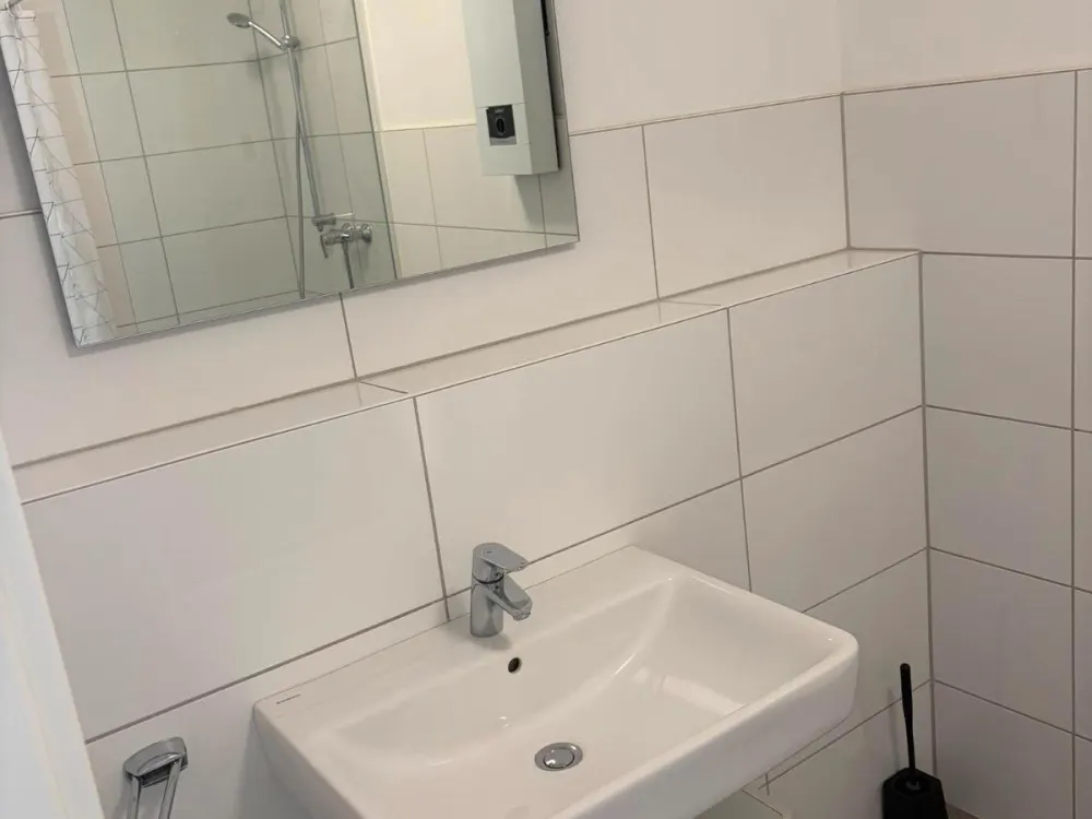 Moderne, möblierte 1-Zimmer-Wohnung mit Balkon & TG-Stellplatz