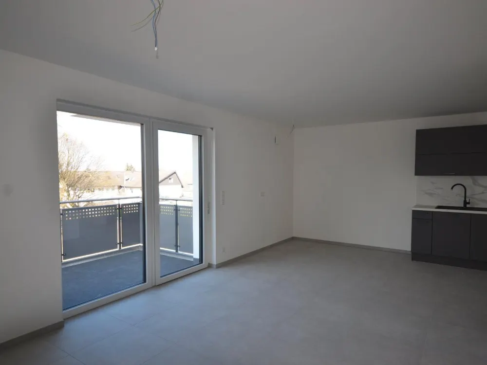 Modern 3-room new-build apartment with balcony, fitted kitchen and underground parking space, directly at the university