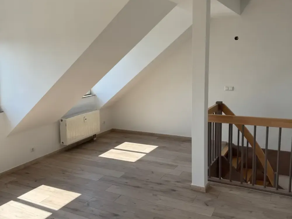 Charming 2-Room Attic Maisonette with Two Bathrooms, New Staircase, Parking Space and Aue
