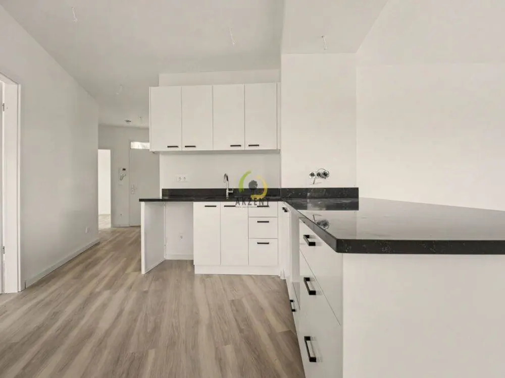 Erstbezug - Stilvolle 2-Zimmer-Neubauwohnung mit Balkon, EBK & Möblierung - Direkt am S-Bahnhof