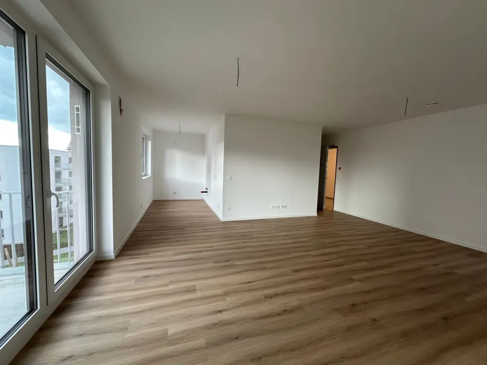Erstbezug im Neubau - 3 Zimmer Wohnung mit offener Wohnküche, Balkon und Fußbodenheizung