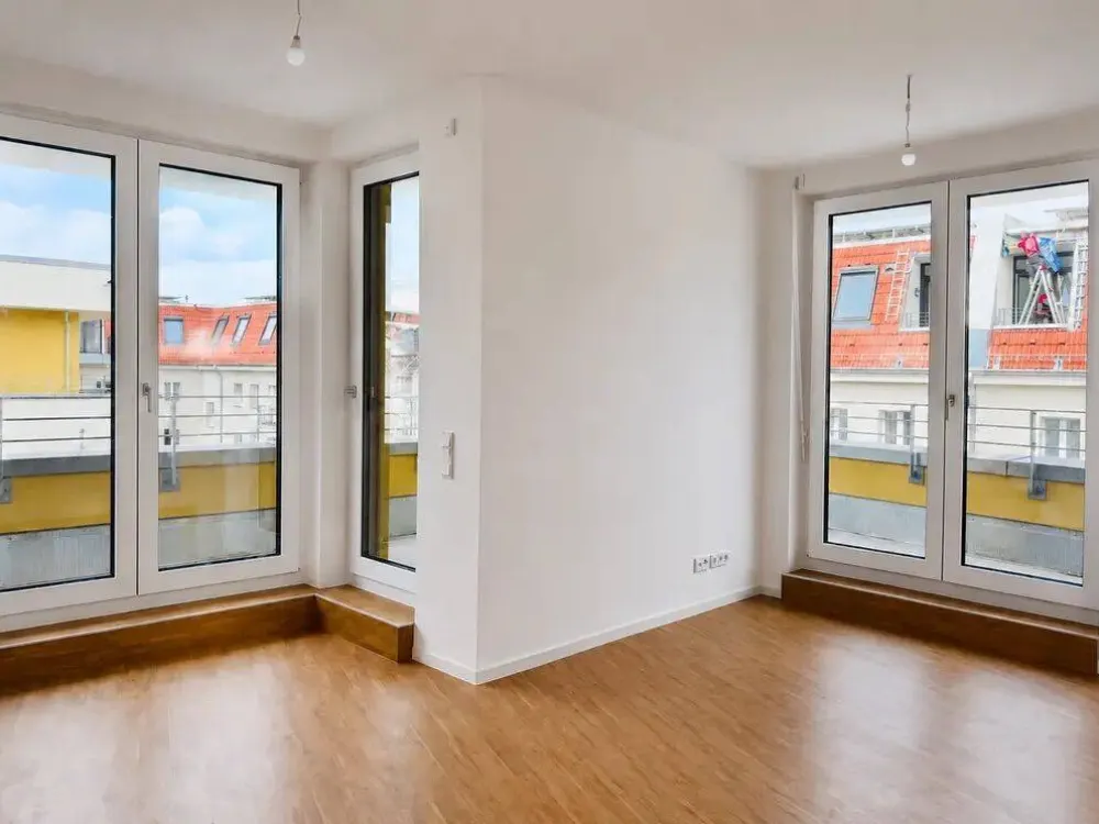 Erstbezug: 2-Zimmer-Neubau-Penthouse mit 21 m² Sonnenterrasse, Einbauküche & Aufzug