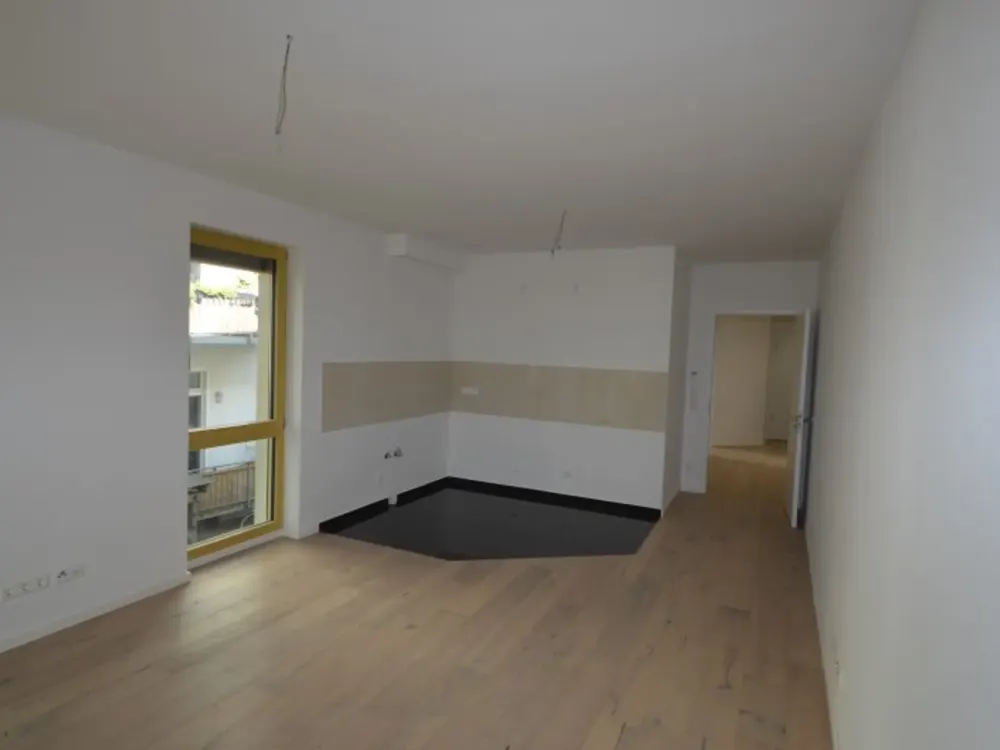 HOFGEBÄUDE - Neubau im Zentrum-Süd! 2-Zimmerwohnung im EG mit Terrasse und Garten