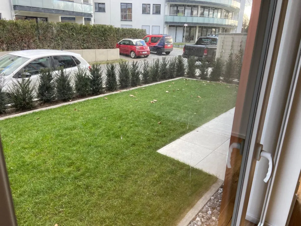 First-class 2-room new-build apartment with garden and underground parking space