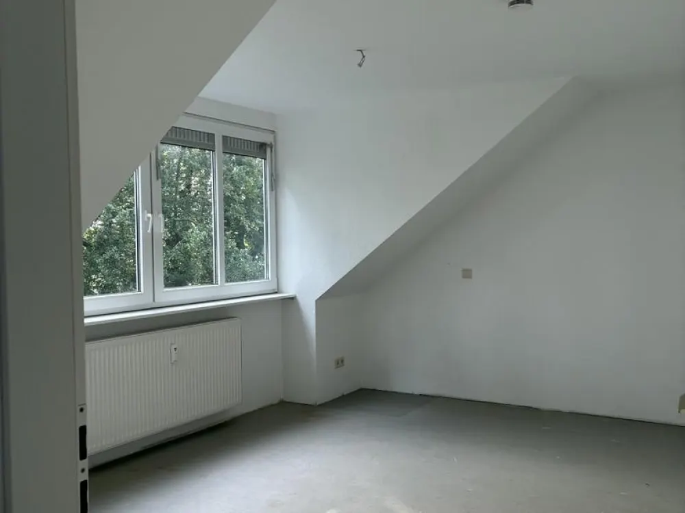 Bright Top-Floor Apartment in a Quiet Location