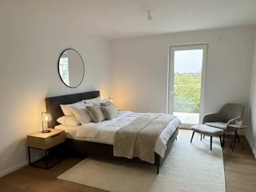 Großzügige 2-Zimmer-Neubauwohnung mit hochwertiger Einbauküche und eigenem Gartenanteil