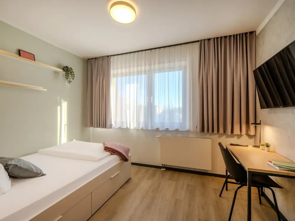 Furnished micro apartments with community spaces, coworking and gym
