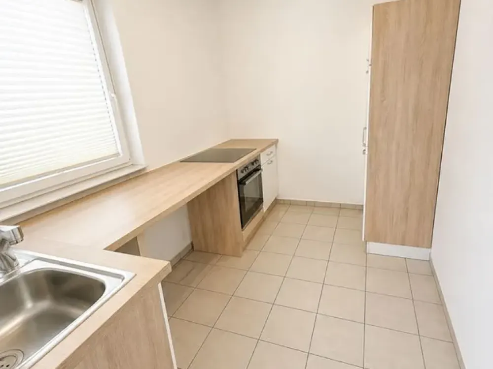 Gepflegte 1,5-Zimmer-Souterrainwohnung mit Fußbodenheizung und Einbauküche