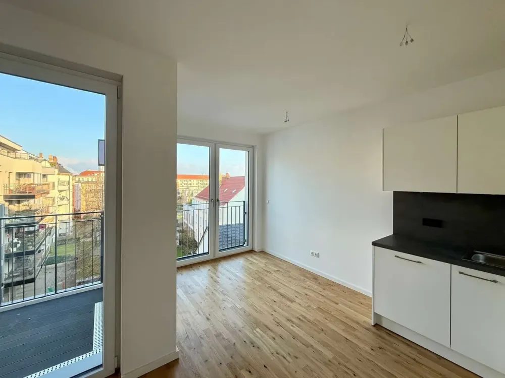 Erstbezug /// Perfekte 2-Zimmer-Wohnung mit Parkett, Balkon und Einbauküche.