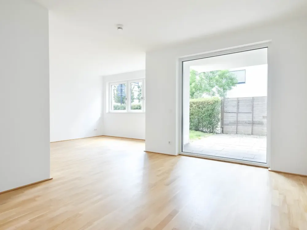 O-Quartier. Moderne 3-Zimmer-Erdgeschosswohnung mit Terrasse und Garten.