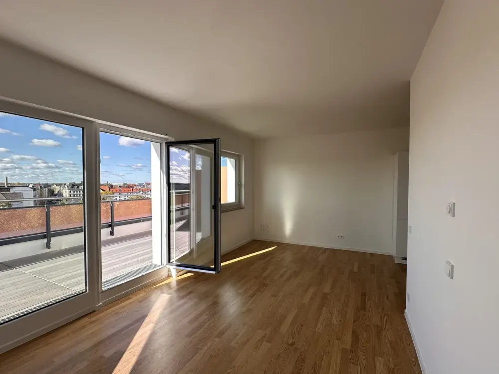 Moderne 2-Zimmer Wohnung mit Einbauküche und großer Terrasse über den Dächern von LE