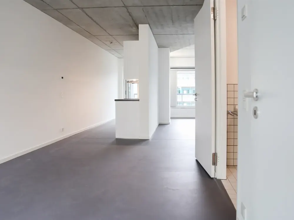 Fühlt sich an wie 3 Zimmer - mit stylischen Sichtbetondecken im 6. OG eines modernen Neubaus