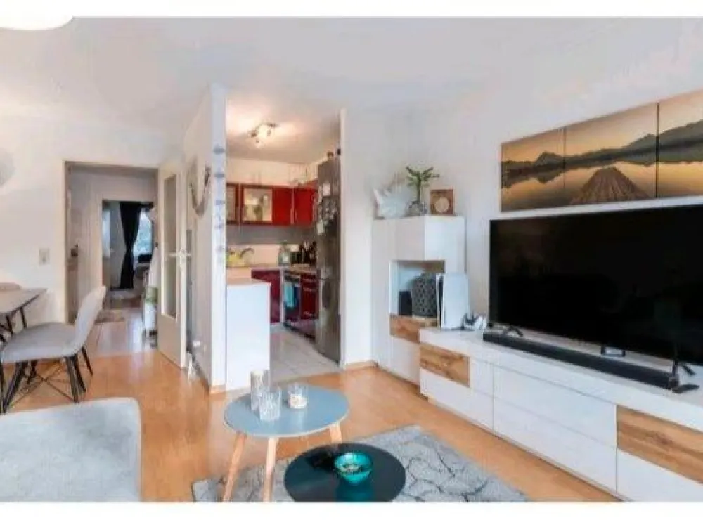 2-room ground floor apartment with terrace, garden & underground parking space