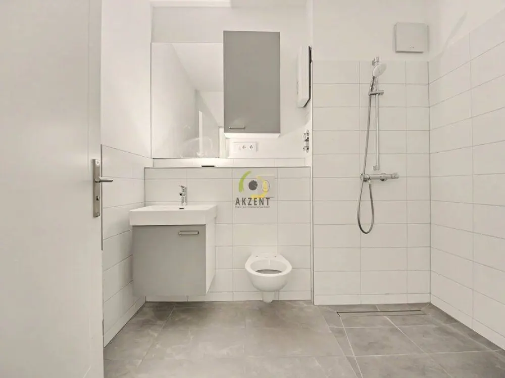 Erstbezug - Stilvolle 1,5-Zimmer-Neubauwohnung mit Balkon, EBK & Möblierung - Direkt am S-Bahnhof