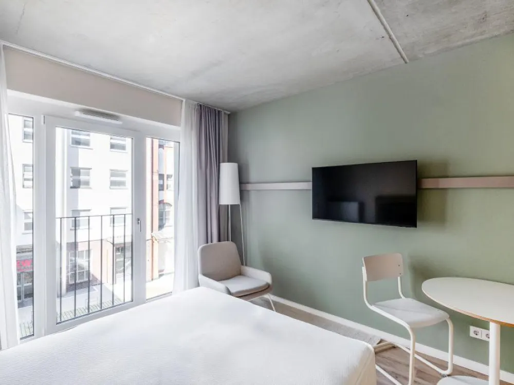 Modernes Studioapartment mit Gym, Coworking & Rooftop am Schloss Charlottenburg