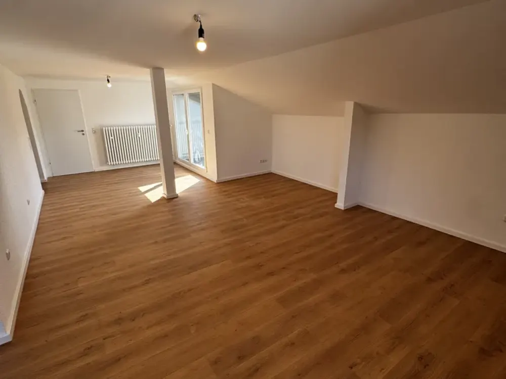Charming, fully renovated 3-room attic apartment with loggia